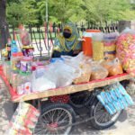 Woman Vendor Offers Snacks on Handcart at Multan’s General Bus Stand Road