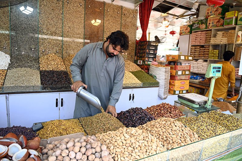 Vendor Showcases Dry Fruits at Weekly Bazaar in Islamabad