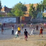 Youth Engage in Volleyball Match in Multan Village