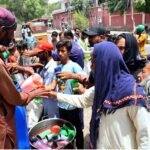 Volunteers Distribute Cold Drinks to Beat Urban Heatwave
