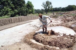 Labourers in Bahawalpur Prepare Clay for Brick-Making Amid Rising Demand