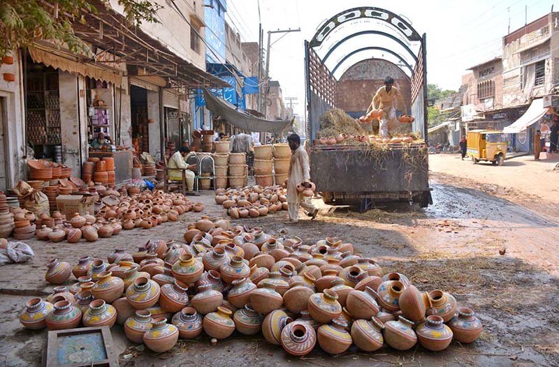 Labourers Unload Clay Pots at Daulat Gate Pottery Market
