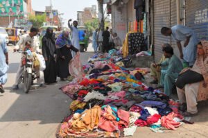 Vibrant Garment Displays Attract Shoppers in Multan’s Bustling Markets